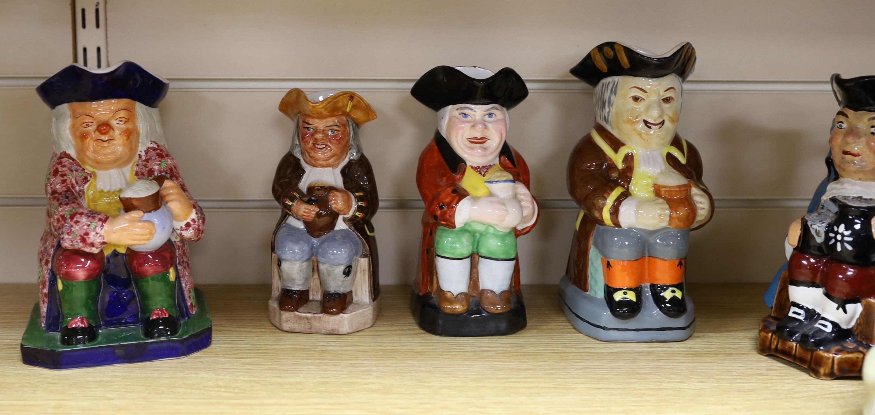 A Copeland Toby jug and twelve other Toby jugs